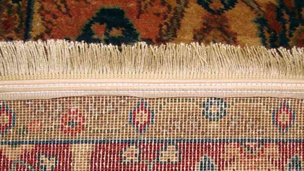 Examine the Persian rug Fringe 