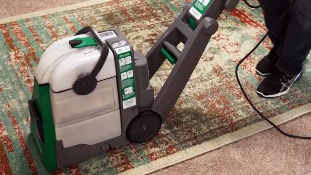 How do you use a BISSELL carpet cleaner on a rug?